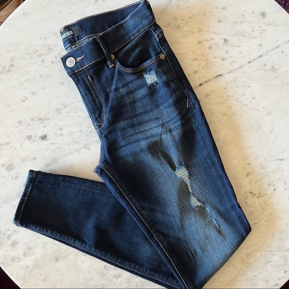Express medium wash distressed skinny jeans